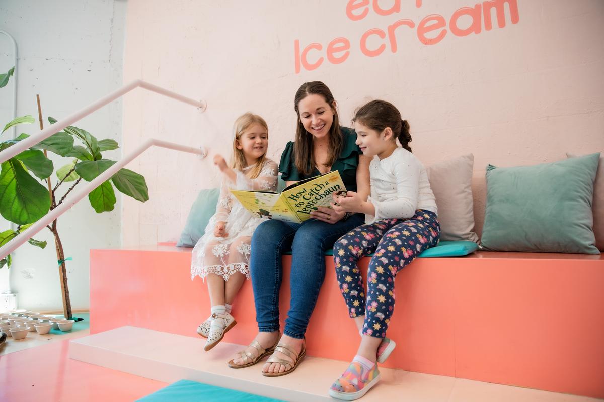 Ms. Amanda reading with students